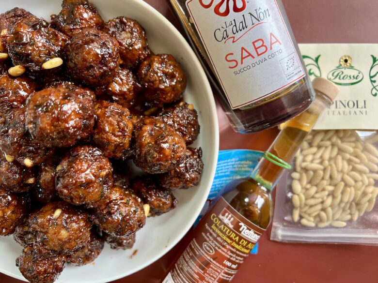 meatballs with saba, colatura, and pine nuts