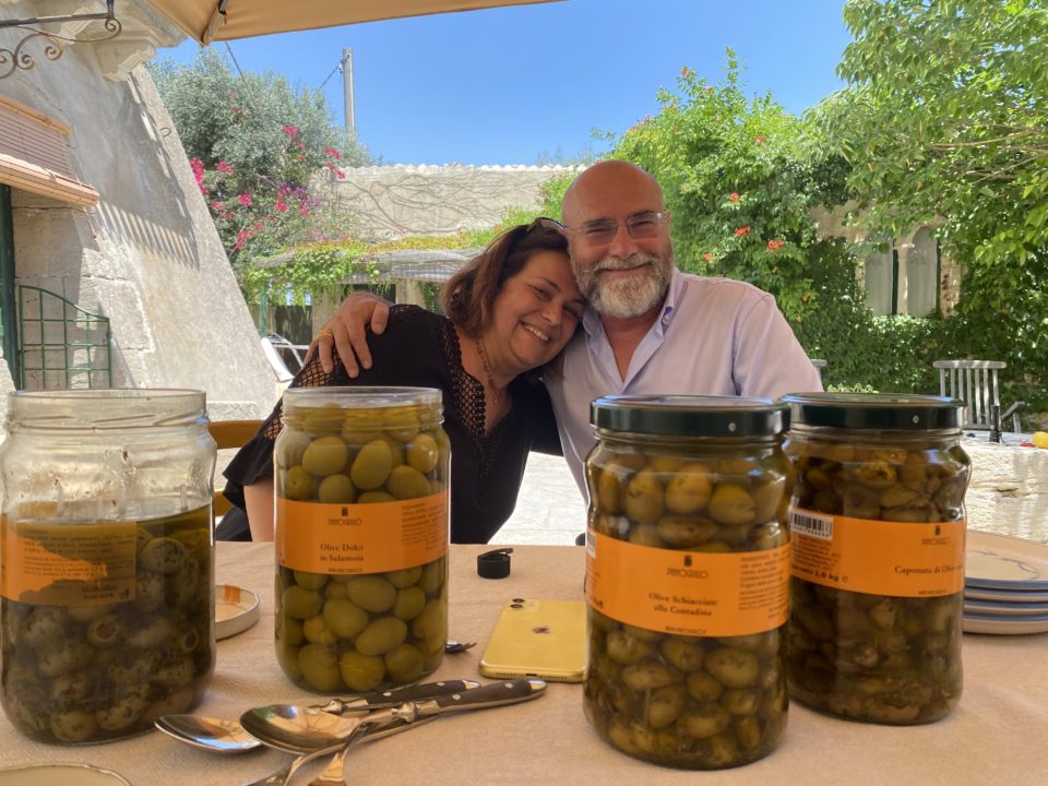 Olive producers and jars of Casetlvetrano olives