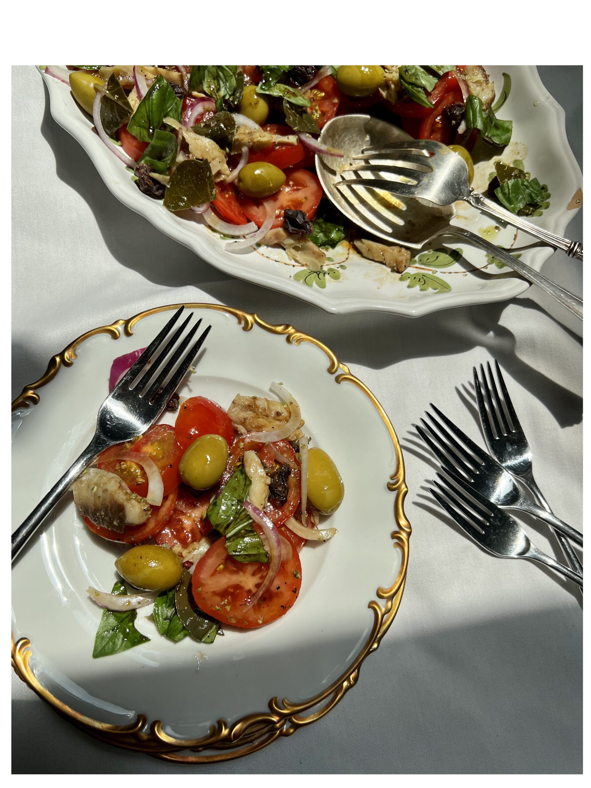 salad with castelvetrano olives caper leaves zibibbo raisins oregano sugarello