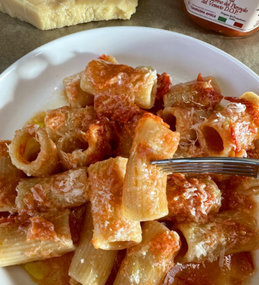pasta allo scarpariello with piennolo tomatoes rigatoni faella vacche rosse cheese